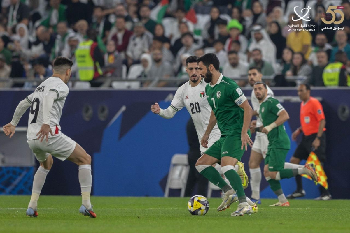 Palestine and Syria players in action during their final Group A match at Education City Stadium yesterday.