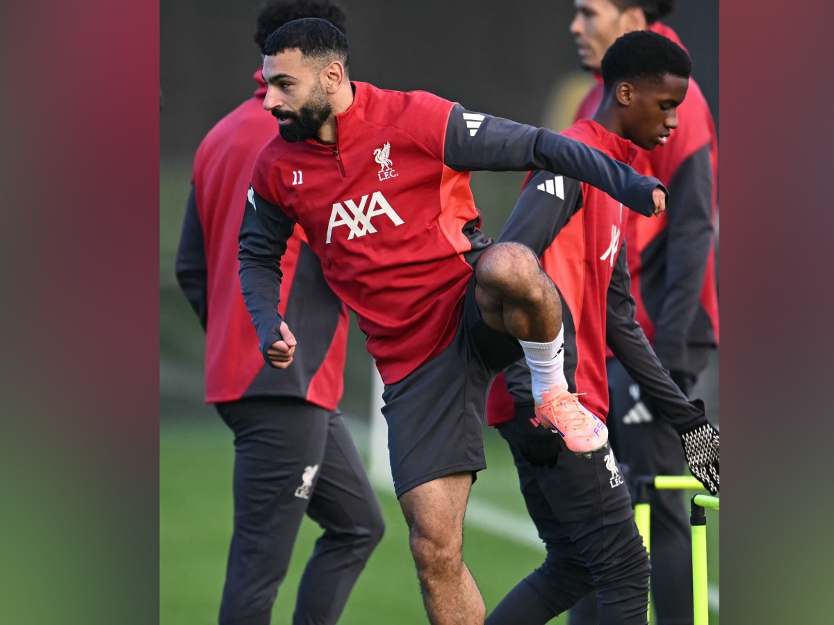 Liverpool’s Mohamed Salah (left) attends a team training session.