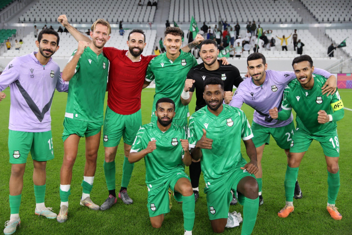 Al Ahli players celebrate their win.