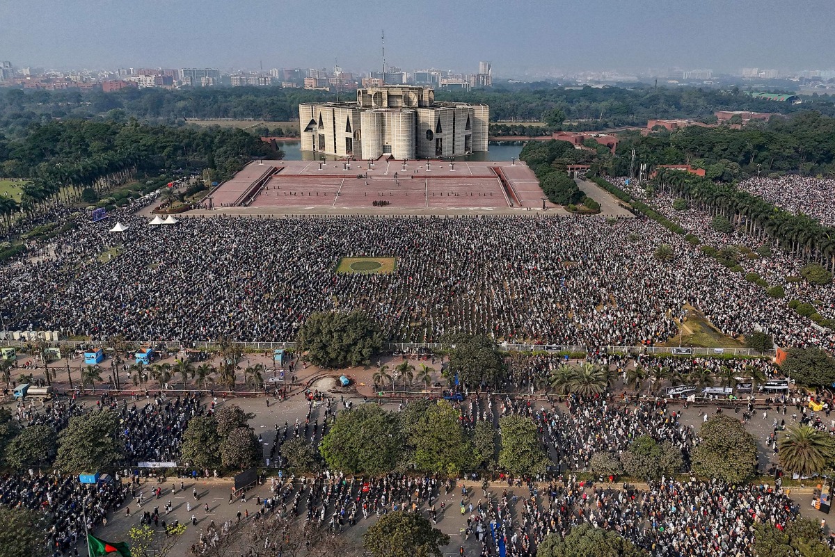 An aerial view shows mourners gathered for the funeral ceremony of Bangladesh's former prime minister Khaleda Zia at the Parliament House premises in Dhaka on December 31, 2025 a day after her death. Photo by S M Ariful AMIN / AFP