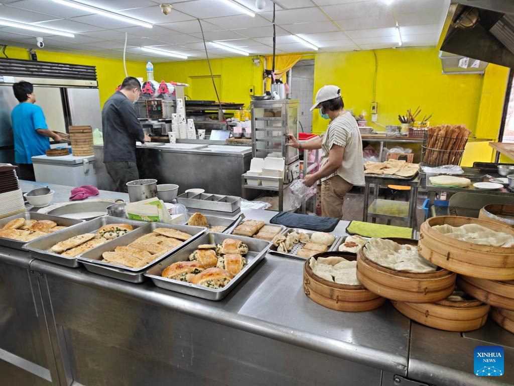 Staff work at a breakfast shop in Taipei, southeast China’s Taiwan.