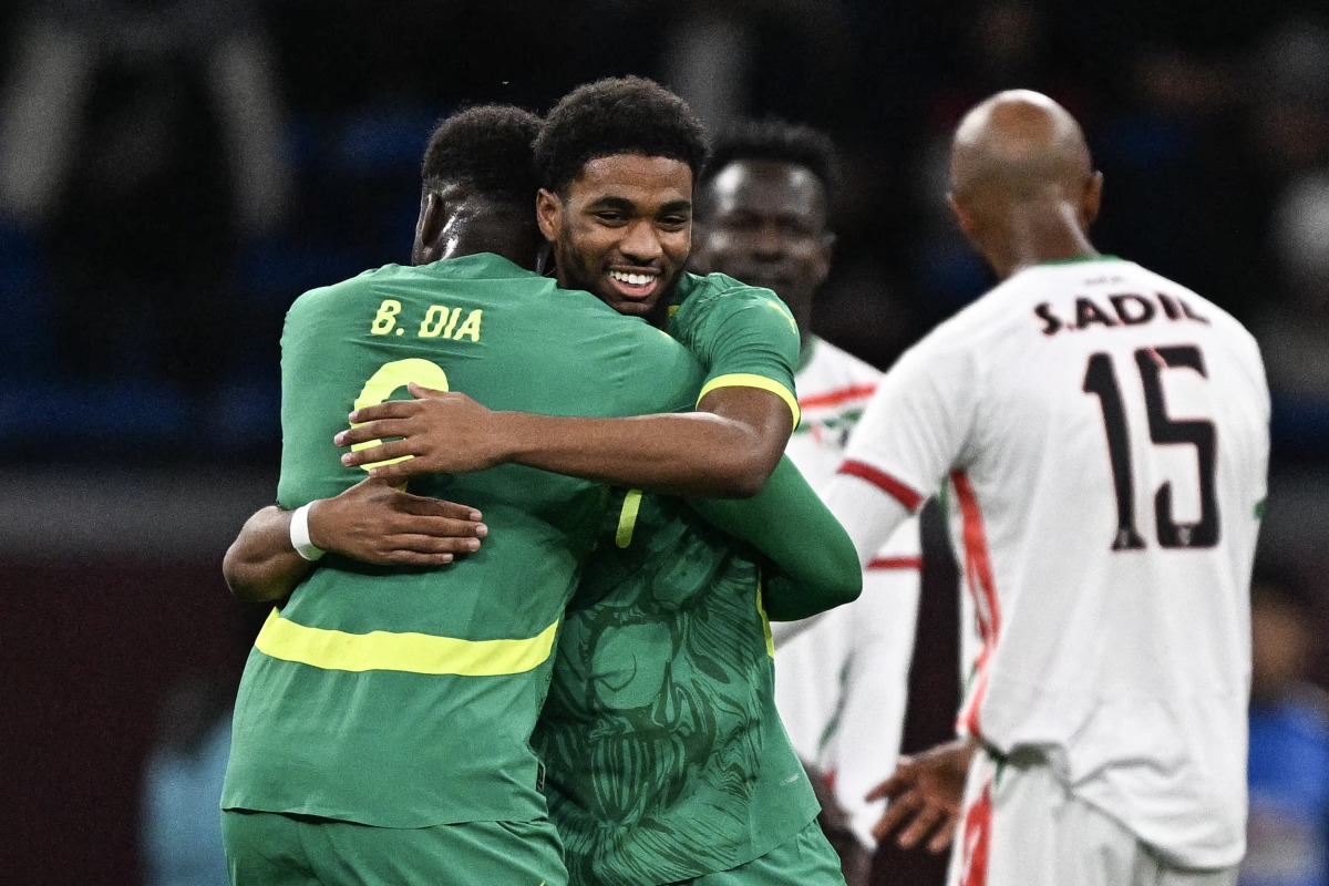 Senegal's forward #27 Ibrahim Mbaye (2 L) celebrates scoring his team's third goal with Senegal's forward #09 Boulaye Dia (L) during the Africa Cup of Nations (CAN) round of 16 football match between Senegal and Sudan at Grand Stadium in Tangiers on January 3, 2026. (Photo by Gabriel BOUYS / AFP)
