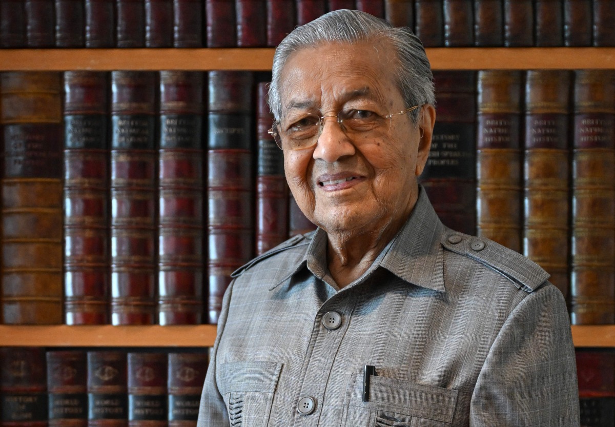 This picture taken on May 5, 2025 shows Malaysia's former prime minister Mahathir Mohamad posing for a picture at his office in Putrajaya. Photo by Mohd RASFAN / AFP