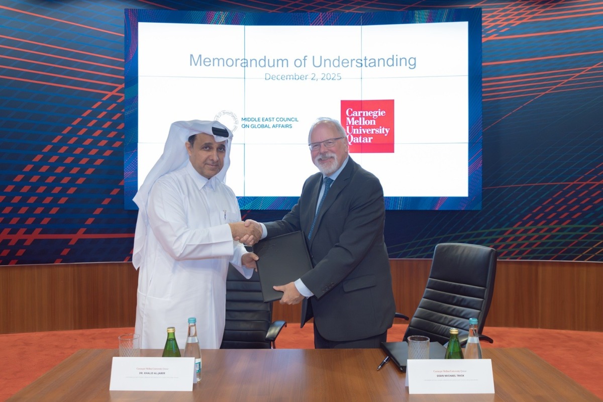 CMU-Q’s Dean Michael Trick and Executive Director of the ME Council Dr. Khalid Al-Jaber during the signing ceremony. 