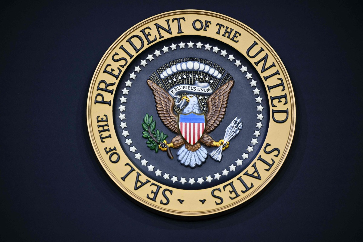 The presidential seal is seen as US President Donald Trump speaks during the House Republican Party (GOP) member retreat at the Kennedy Center in Washington, DC, on January 6, 2026. (Photo by Mandel NGAN / AFP)