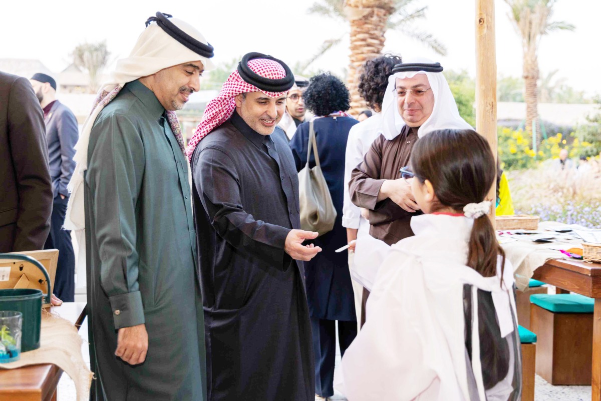 Minister of Environment and Climate Change H E Dr. Abdulla bin Abdulaziz bin Turki Al Subaie and officials interacting with students during the event at Al Khater House on Wednesday. 