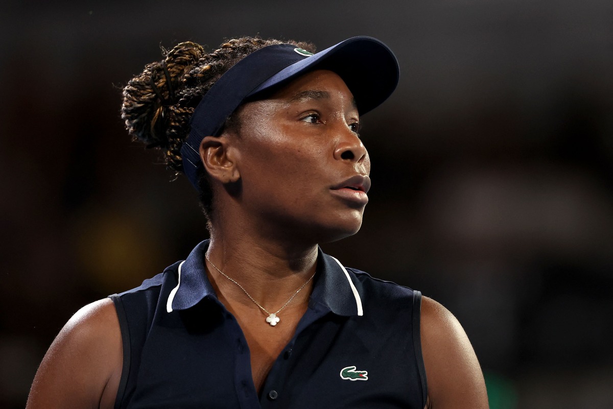 USA's Venus Williams reacts on a point to Serbia痴 Olga Danilovic during their women's singles match on day one of the Australian Open tennis tournament in Melbourne on January 18, 2026. (Photo by Martin KEEP / AFP)
