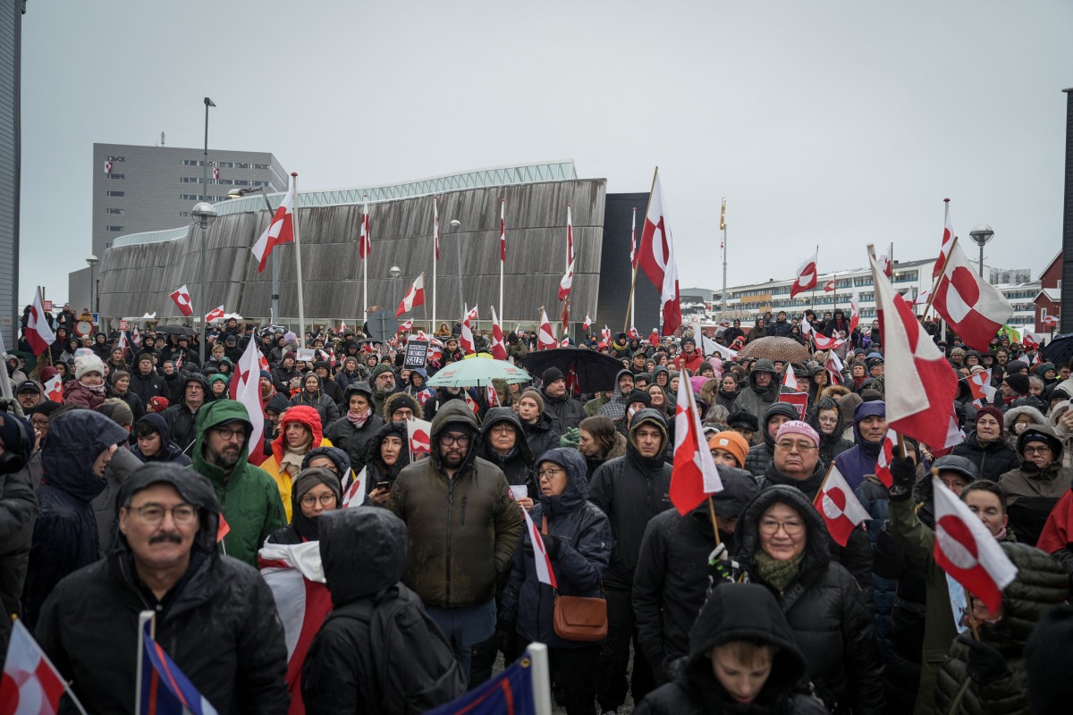 Photo for representation only. People take part in a demonstration that gathered almost a third of the city population to protest against the US President's plans to take Greenland, on January 17, 2026 in Nuuk, Greenland. (Photo by Alessandro RAMPAZZO / AFP)
