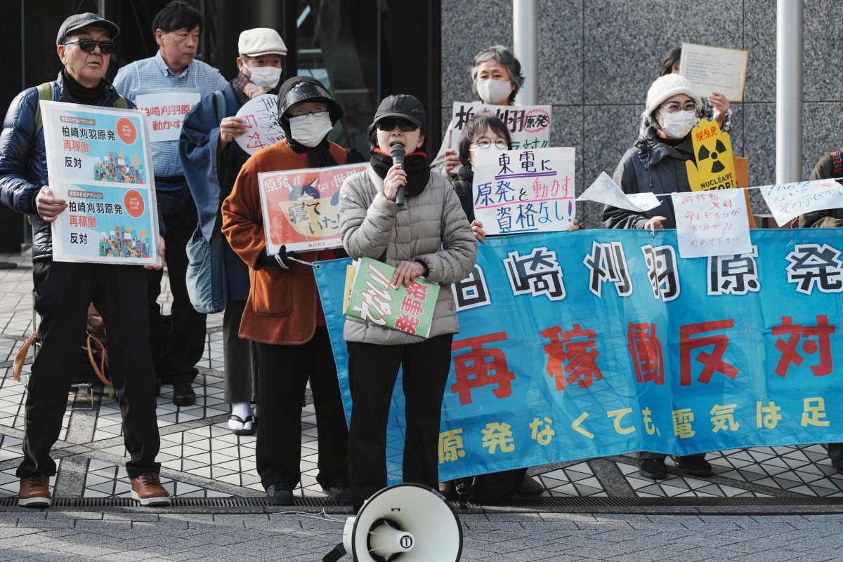 Participants demonstrate in front of the Tokyo Electric Power Company's headquarters, against the restart of the Kashiwazaki-Kariwa nuclear Power Plant, in Tokyo on January 19, 2026. Photo by Kazuhiro NOGI / AFP
