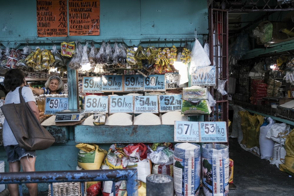 Rice prices are displayed at a market stall Quezon City, Metro Manila, the Philippines, on Saturday, April 6, 2024. (Photo by Veejay Villafranca/Bloomberg)