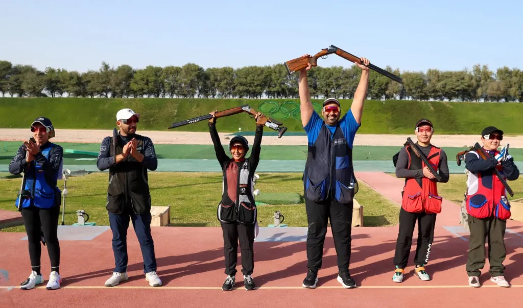 Qatar shooters Mohammed Al Rumaihi and Kholoud Al Khalaf celebrate their mixed team trap triumph. 