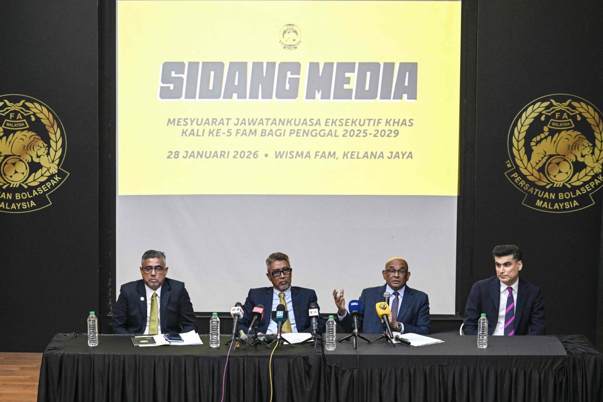 Asian football confederation (AFC) general secretary Windsor John (2nd R) talks as his deputy Vahid Kardany (R), Malaysian football association's (FAM) acting president Yusoff Mahadi (2nd L) and FAM's secretary general Noor Azman Rahman (L) listen during a press conference at the FAM's headquarters in Kuala Lumpur on January 28, 2026. (Photo by Mohd Rasfan / AFP)