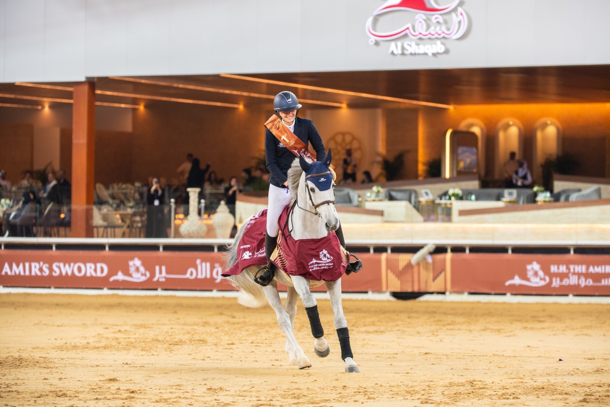 France’s Lara Tryba, aboard Chageorge, celebrates her triumph. 