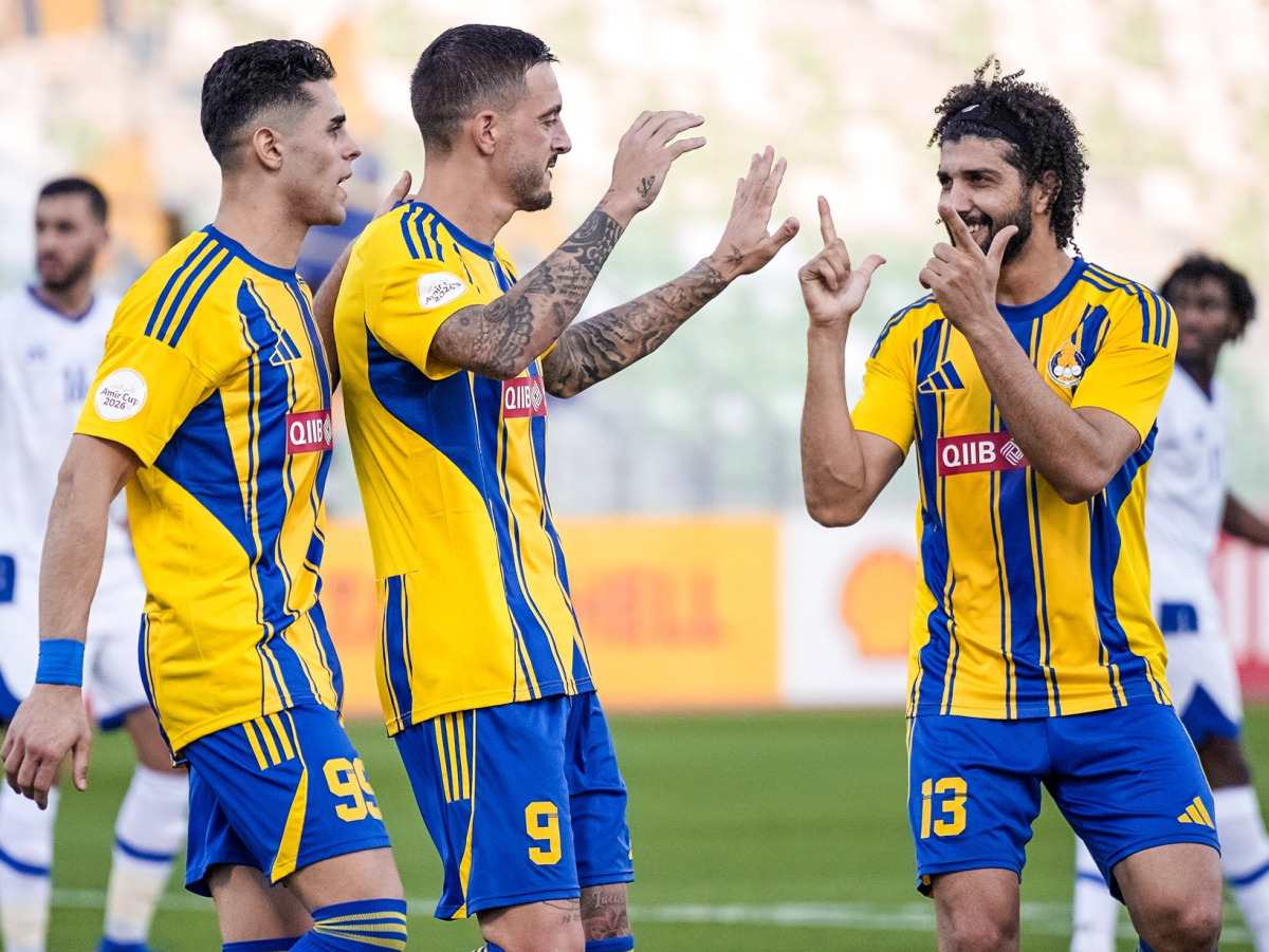 Al Gharafa’s Joselu (centre) celebrates with teammates.  