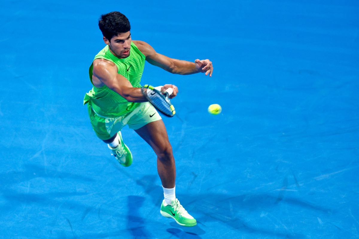 Spain’s Carlos Alcaraz hits a return against France’s Valentin Royer. PICS: AFP