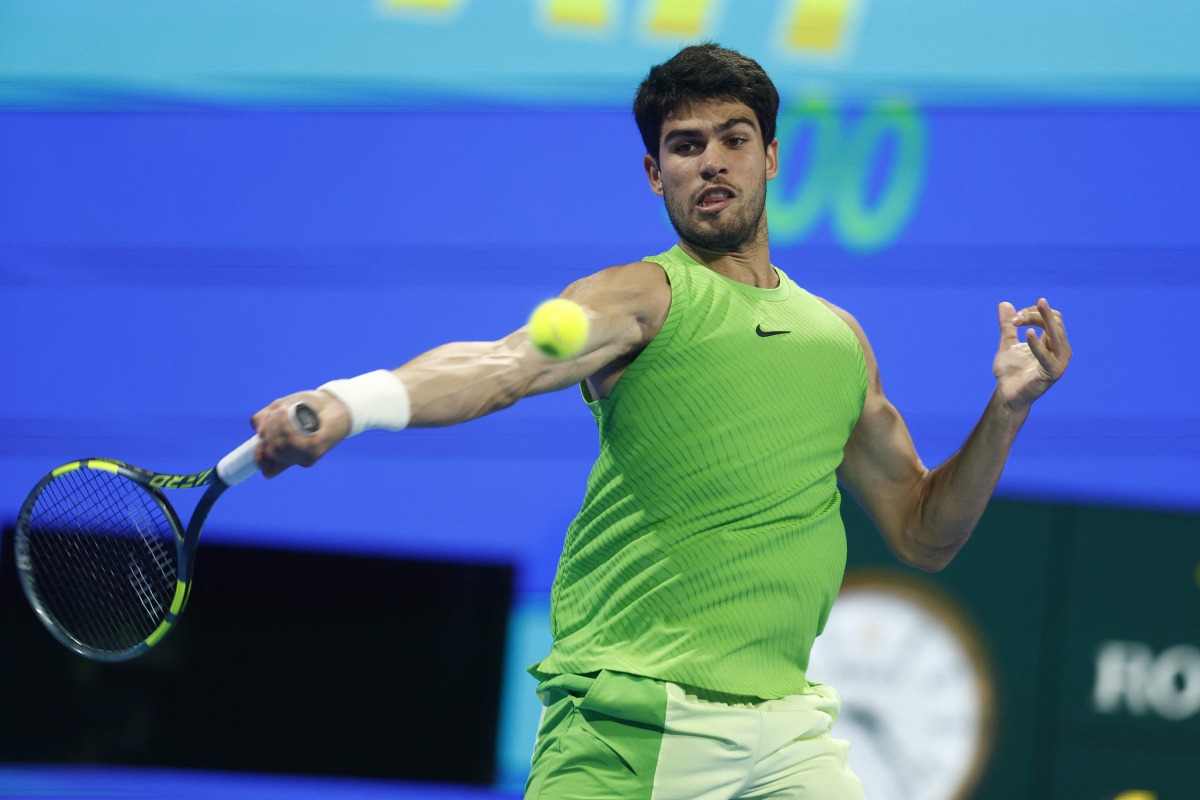 Spain’s Carlos Alcaraz hits a return against Russia’s Karen Khachanov. (AFP)