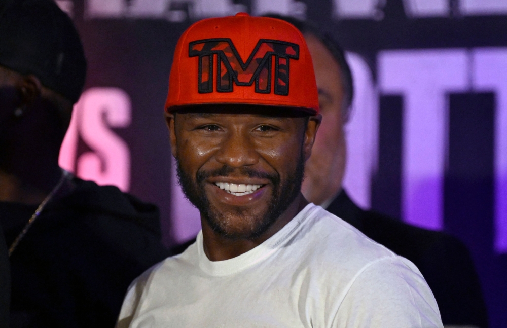 US boxer Floyd Mayweather Jr. smiles during the weighing ceremony for his upcoming exhibition fight against John Gutti III in Mexico City on August 23, 2024. . (Photo by Alfredo Estrella/ AFP)