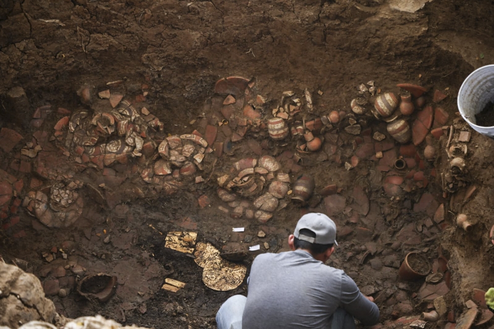This handout picture released by Panama Ministry of Culture shows an archaeologist working inside a pre-Hispanic tomb approximately 1,200 years old, discovered at the El Cano Archaeological Park in Cocle, panama, on February 20, 2026. (Photo by Handout / panama / AFP)