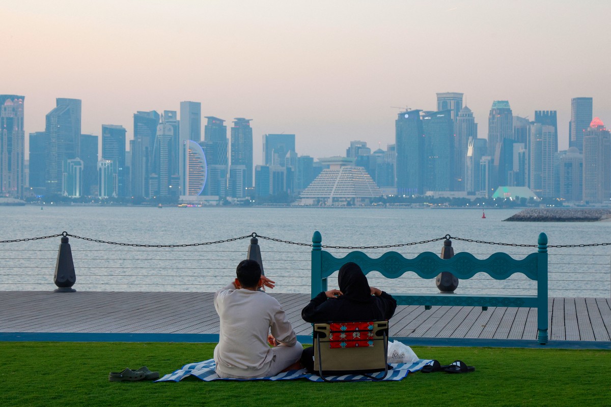 File photo of a family at the Old Doha Port in Qatar on February 24, 2026. (Photo by Karim Jaafar / AFP)