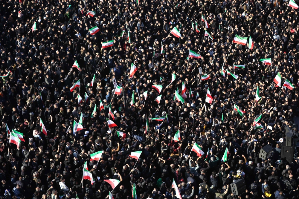 Mourners gather at the death of Iran's supreme leader Ayatollah Ali Khamenei at a square in Tehran on March 1, 2026. (Photo by Atta Kenare / AFP)