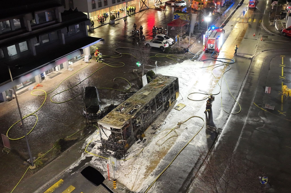 This handout picture taken an released on March 10, 2026 by the Canton of Fribourg shows the main street of the small town of Kerzers where a bus caught fire. (Photo by Handout / Etat de Fribourg - Staat Freiburg / AFP) 