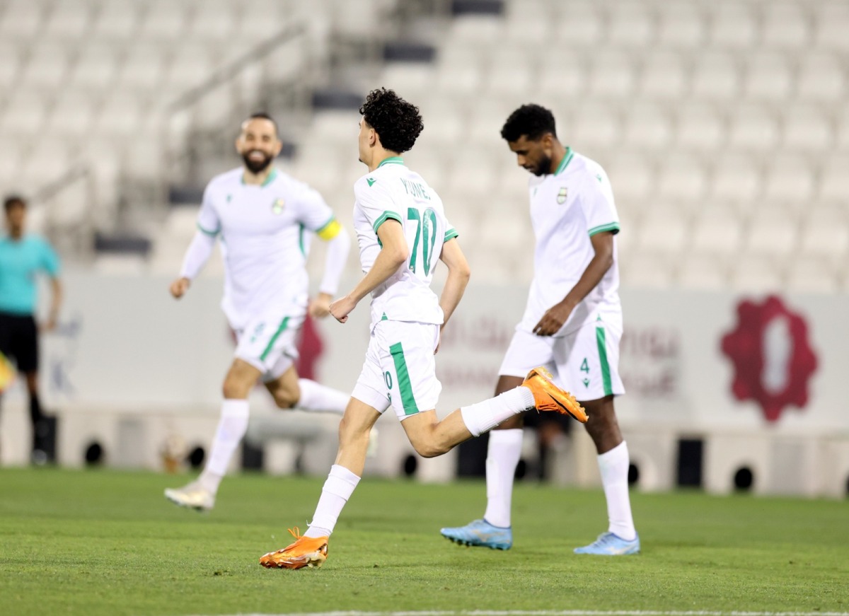 Al Ahli's Younis Abdelrahman (centre) celebrates after scoring a goal against Al Gharafa yesterday.