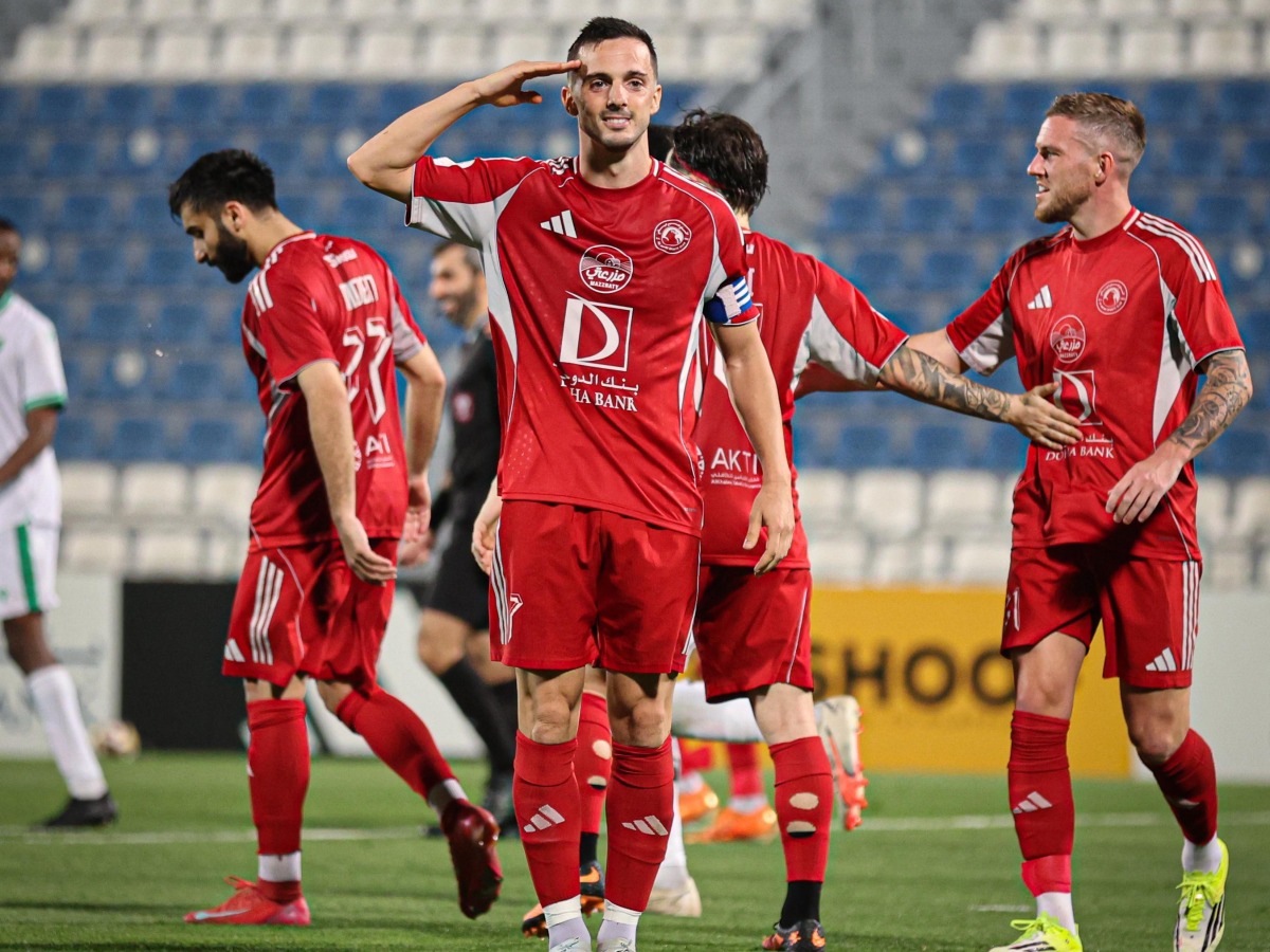 Al Arabi's Pablo Sarabia (centre) celebrates after scoring a goal.