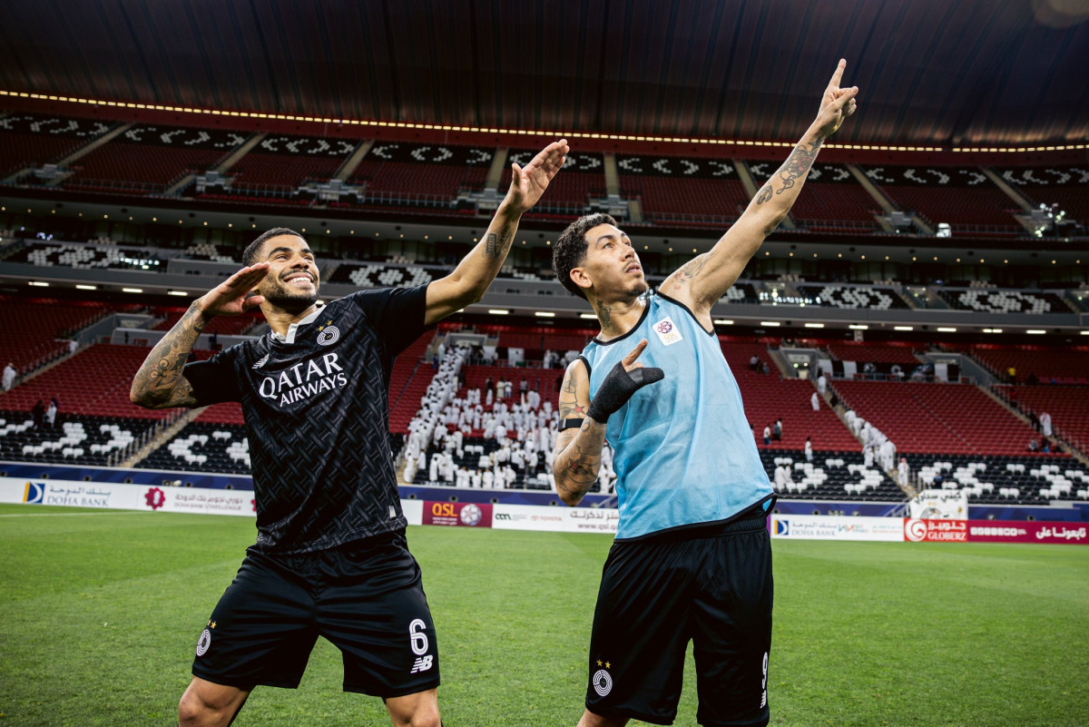 Al Sadd’s Paulo Otavio (left) and Roberto Firmino celebrate a goal during match against Al Sailiya. 