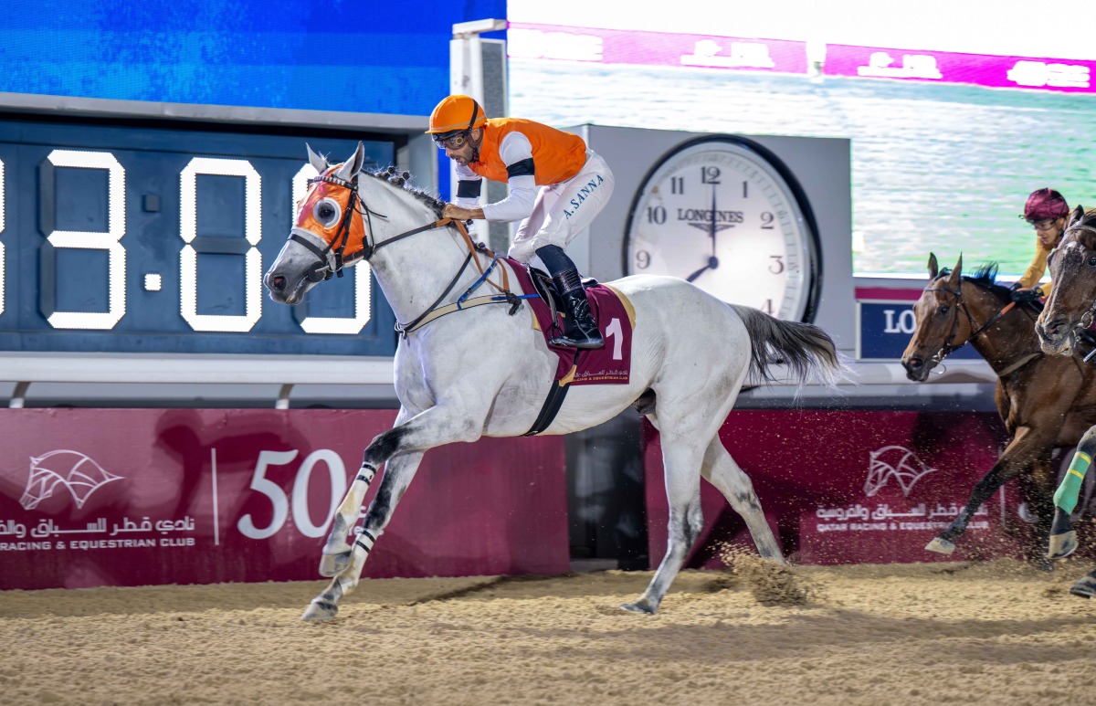 Alberto Sanna and Mutamarrid cross the finish line to win Al Mamoura Cup at Al Rayyan Racecourse. 