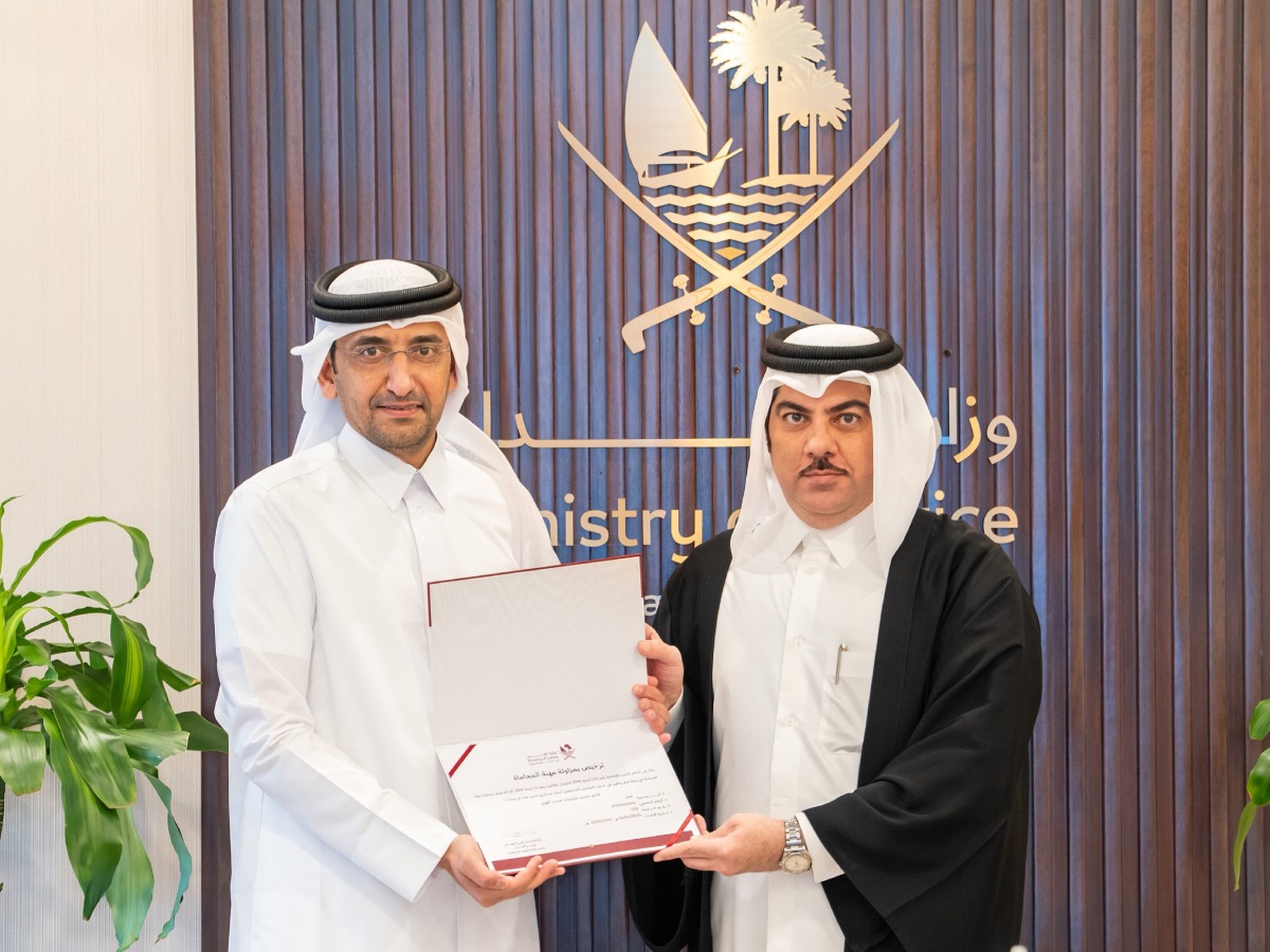Minister of Justice and Minister of State for Cabinet Affairs  H E Ibrahim bin Ali Al-Mohannadi with a lawyer. 