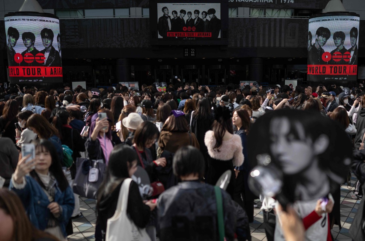 Fans of Korean boy band BTS arrive at Tokyo Dome before the start of the first BTS World Tour ‘Arirang’ in Tokyo on April 17, 2026. Photo by Andrew CABALLERO-REYNOLDS / AFP