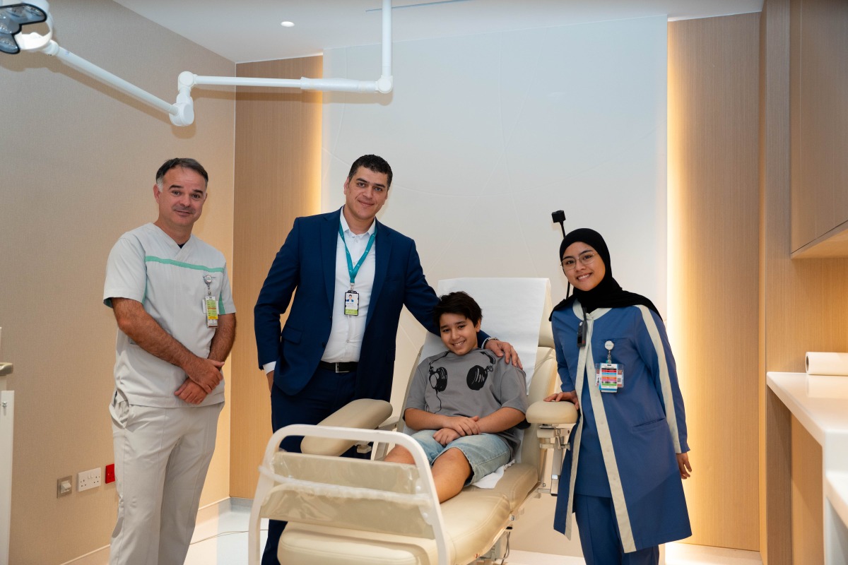 Sidra Medicine team with the young patient. 