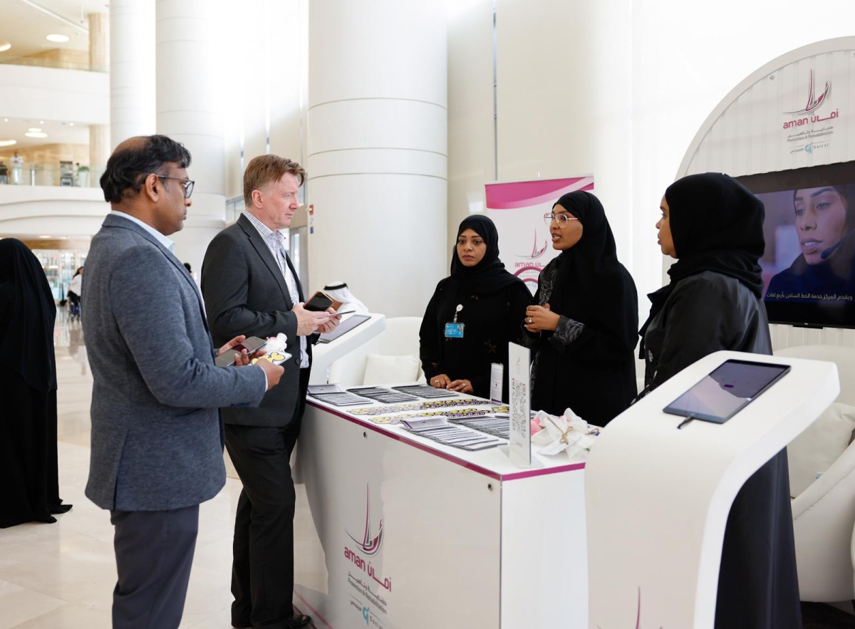 Visitors and representatives at the awareness booth.