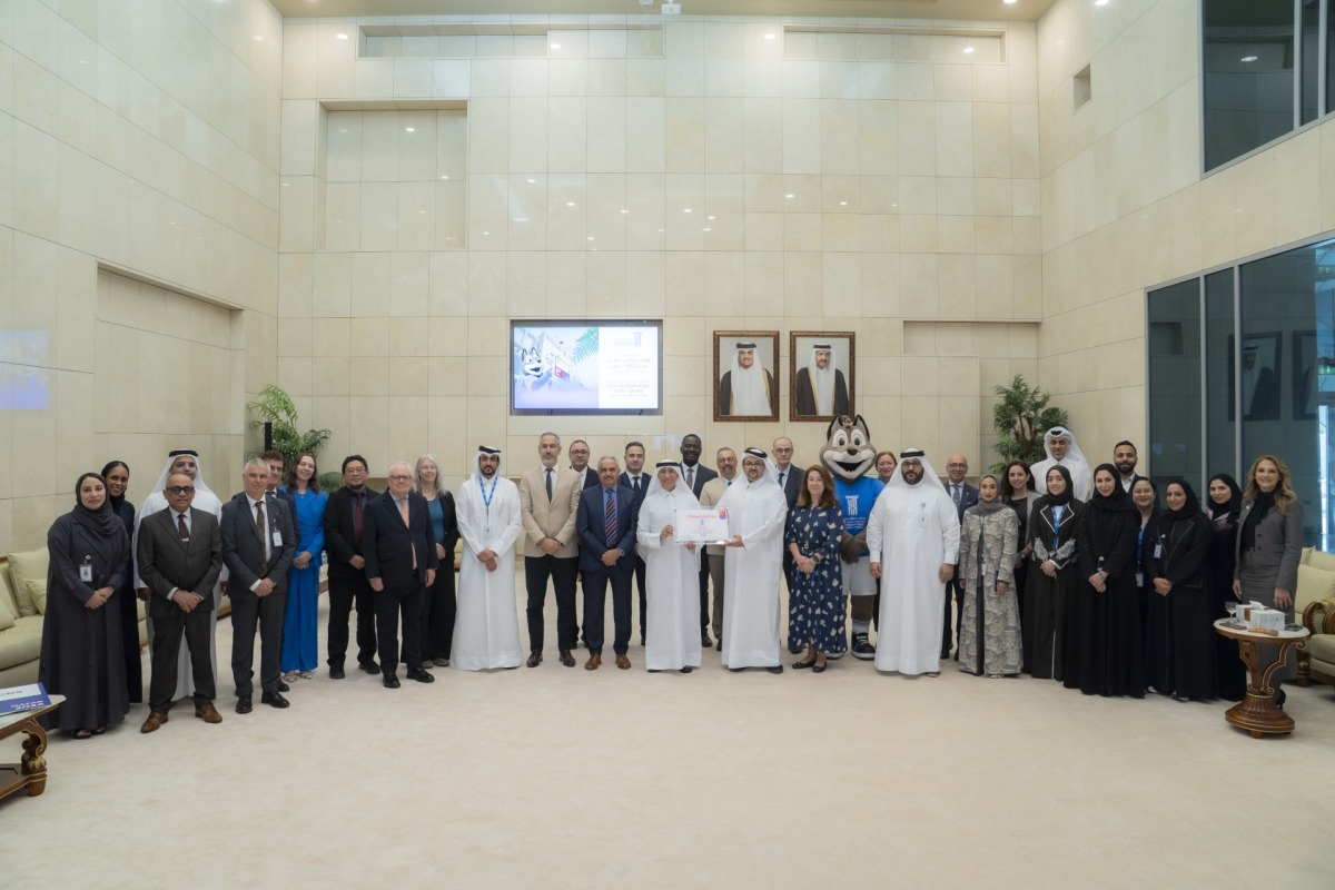 President of UDST Dr. Salem Al-Naemi with other officials receiving the certification. 