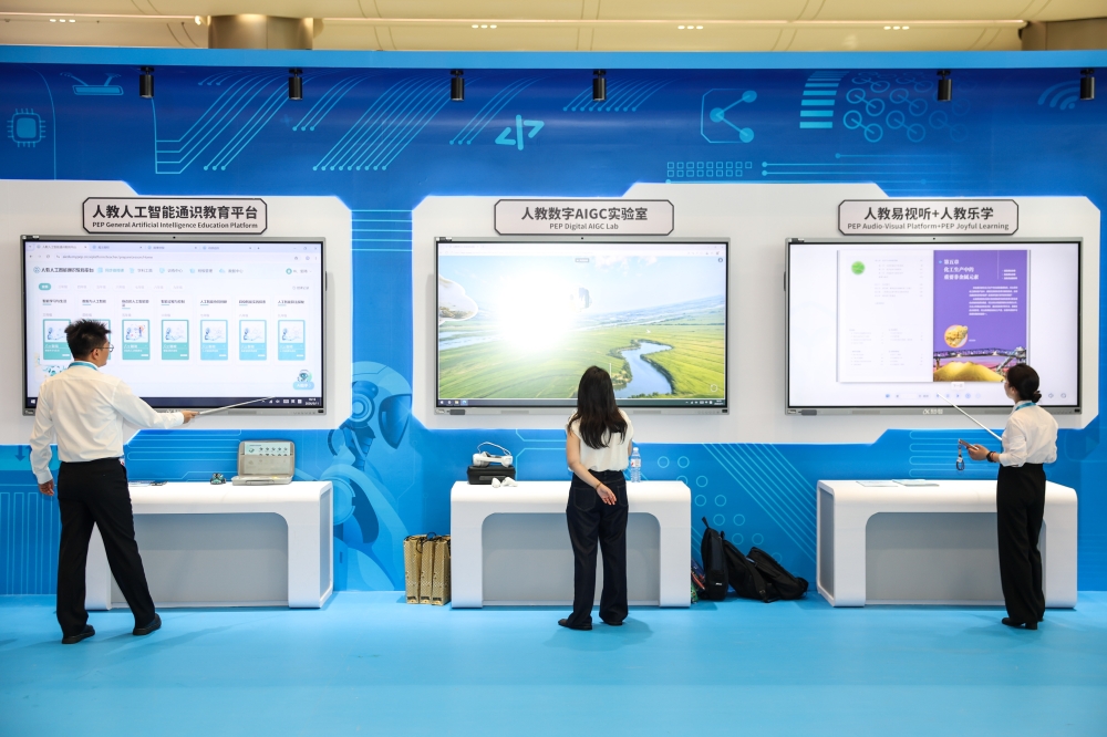 Exhibitors demonstrate products at an exhibition on achievements of global digital education held during the 2026 World Digital Education Conference in Hangzhou, east China's Zhejiang Province. (Xinhua/Jiang Han)
 