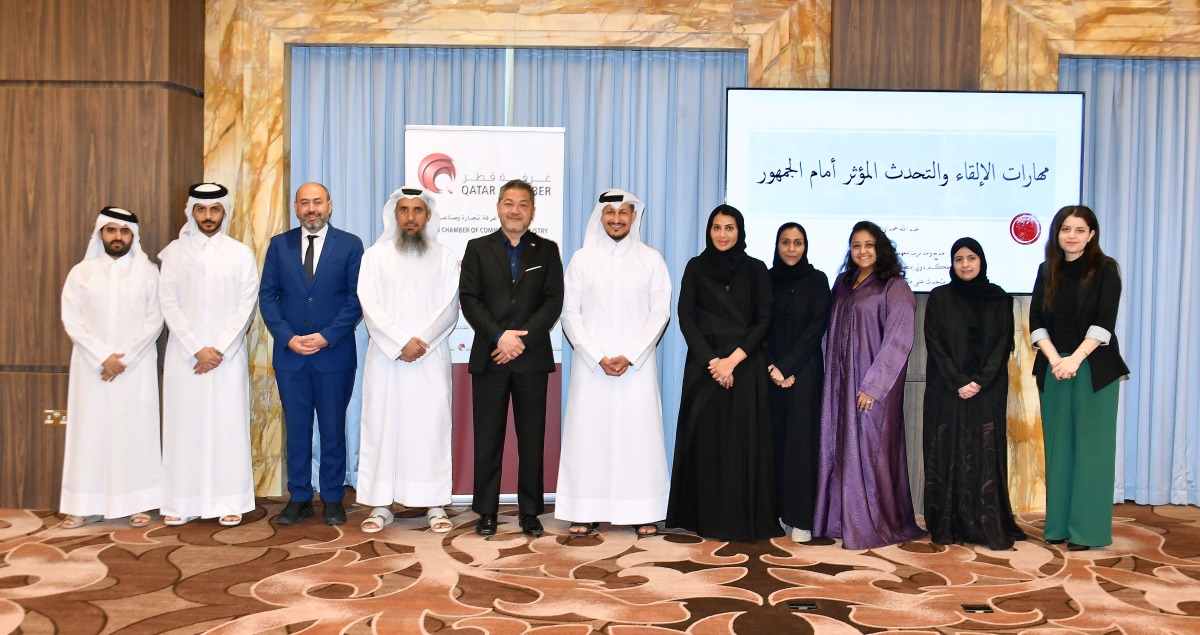 Officials pose for a group photo with the participants of public speaking training programme.