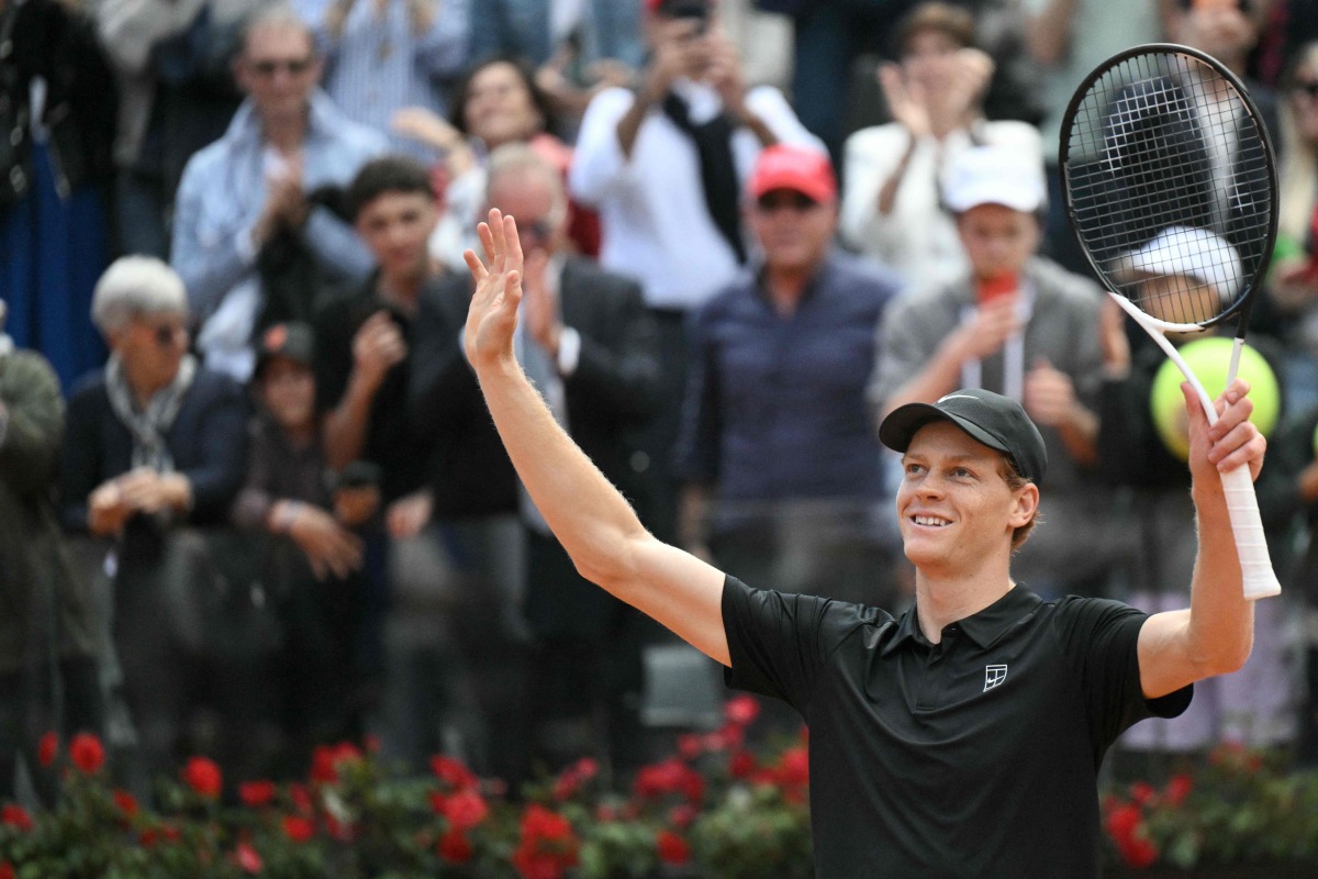 Italy's Jannik Sinner celebrates after winning the semi-final against Russia's Daniil Medvedev at the ATP Rome Open tennis tournament at Foro Italico in Rome on May 16, 2026. (Photo by Tiziana FABI / AFP)