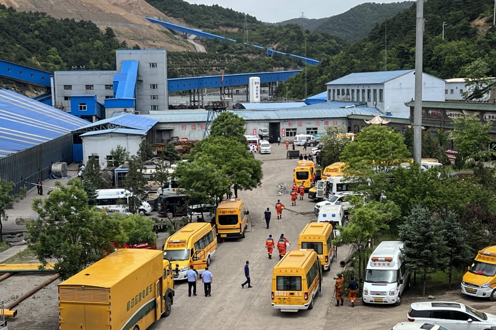 A general view of rescue team members and emergency vehicles arriving at the Liushenyu coal mine after a gas explosion in Changzhi, in northern China's Shanxi province on May 23, 2026. (Photo by CNS / AFP) 