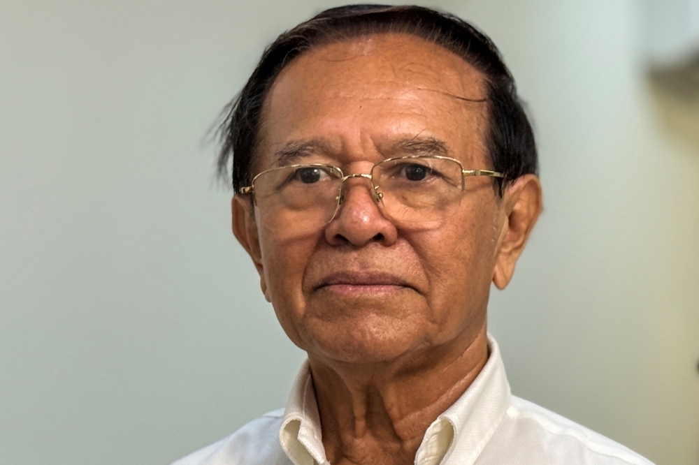Kem Sokha, former leader of the now-dissolved Cambodia National Rescue Party (CNRP), looks on as he visits his mother on the outskirts of Phnom Penh on May 25, 2026. (Photo by Chhea Bunnarith / AFP)

