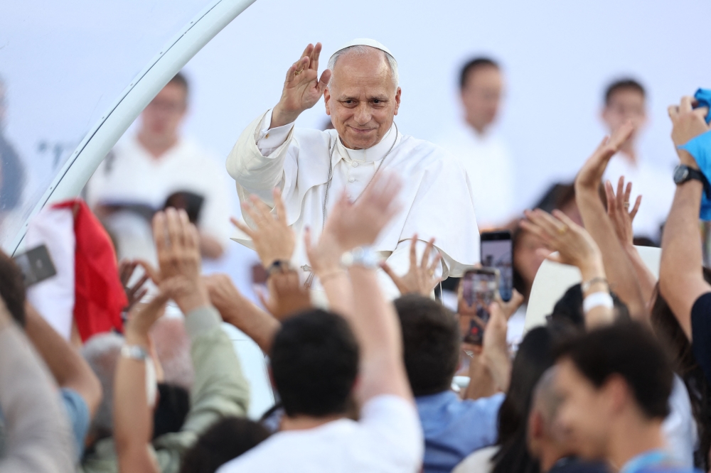 Pope Leo XIV greets the crowd as he arrives to attend a prayer vigil at the Lluis Companys Olympic Stadium in Barcelona, on June 9, 2026. (Photo by Josep Lago / AFP)