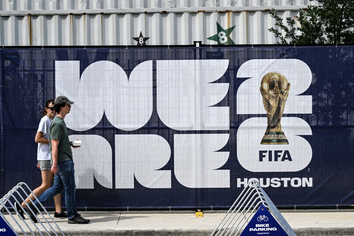 People walk near the FIFA Fan Festival in downtown Houston, Texas, on June 10, 2026, ahead of the 2026 FIFA World Cup. (Photo by RONALDO SCHEMIDT / AFP)