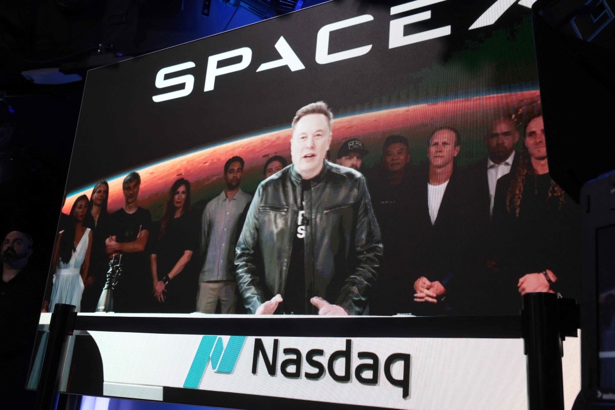 SpaceX founder and CEO Elon Musk speaks via video at the Nasdaq Marketsite in Times Square during the launch of the SpaceX initial public offering (IPO) on the Nasdaq on June 12, 2026, in New York City. Photo by SPENCER PLATT / GETTY IMAGES NORTH AMERICA / Getty Images via AFP