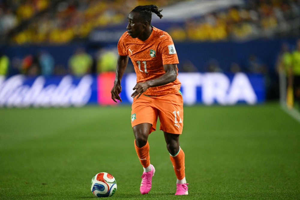 Ivory Coast's forward #11 Yan Diomande runs with the ball during the 2026 World Cup Group E football match on June 14, 2026. (Photo by Mauro Pimentel / AFP)