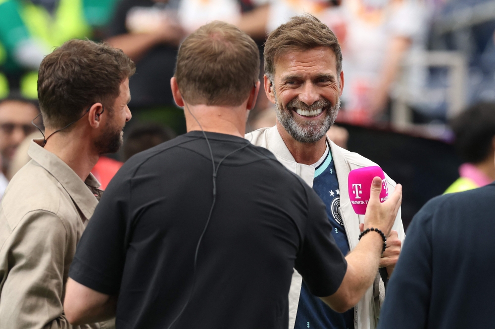 Jürgen Klopp commentates with Julian Nagelsmann, Head Coach of Germany, and Thomas Müller at Houston Stadium on June 14, 2026 in Houston, Texas. Alexander Hassenstein/Getty Images/AFP