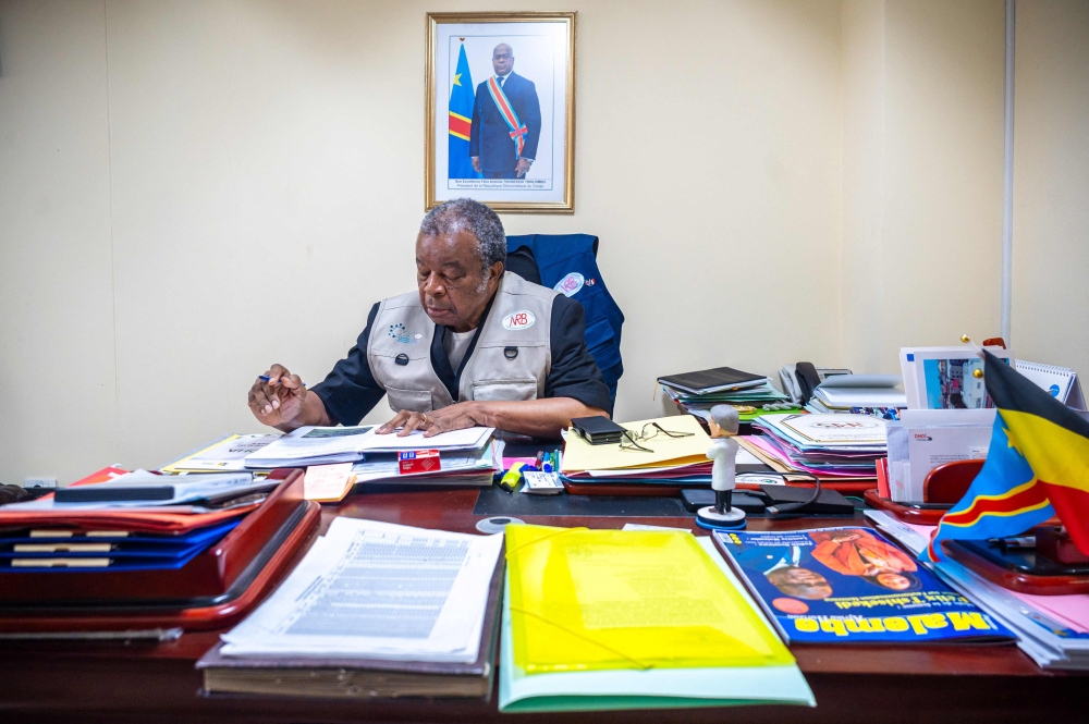 (Files) Professor Jean-Jacques Muyembe, director general of the National Institute for Biomedical Research (INRB), is seen at his office in Kinshasa, Democratic Republic of the Congo, on May 20, 2026. (Photo by Hardy Bope / AFP)