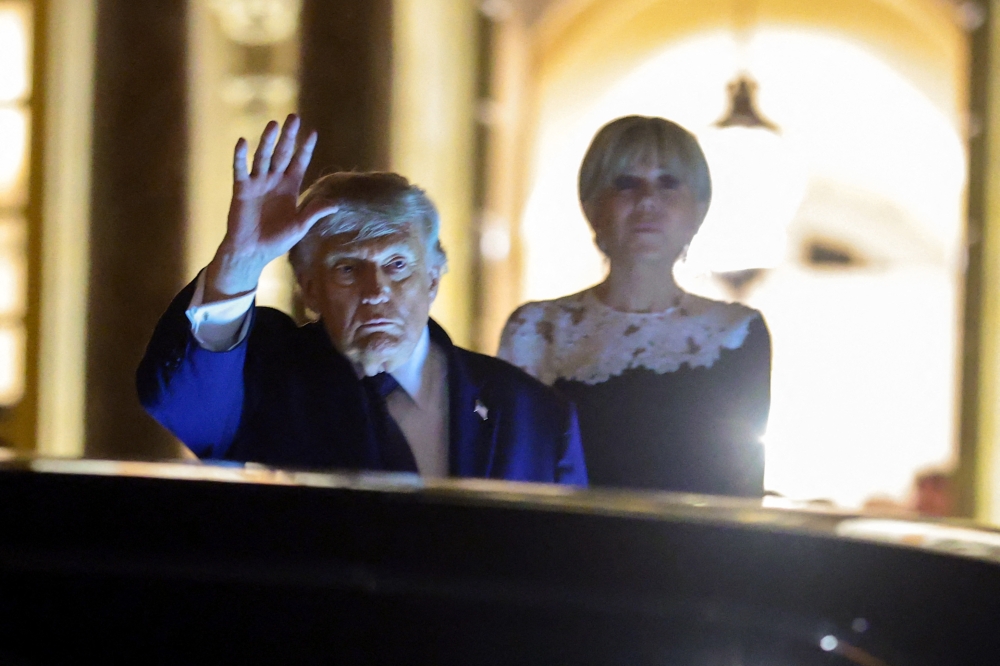 US President Donald Trump waves as he departs a dinner at Chateau de Versailles on June 17, 2026 in Versailles, France. Anna Moneymaker/Getty Images/AFP