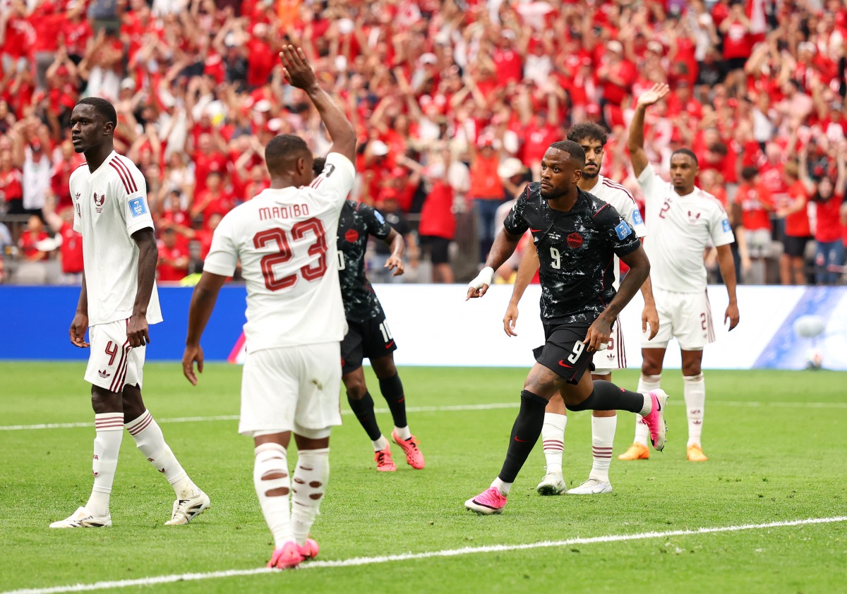 Cyle Larin #9 of Canada celebrates scoring his team's first goal during the FIFA World Cup 2026 Group B match between Canada and Qatar at BC Place Vancouver on June 18, 2026 in Vancouver, British Columbia. (Photo by Fran Santiago / GETTY IMAGES NORTH AMERICA / Getty Images via AFP)
