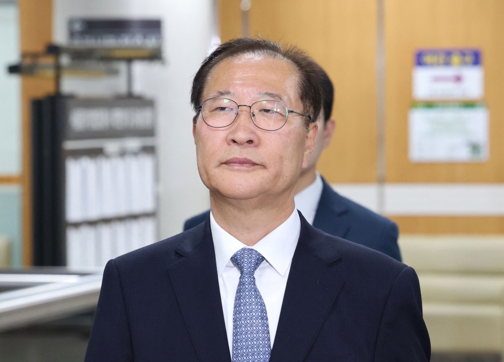 Former Korean Justice Minister Park Sung-jae arrives for his trial at the Seoul Central District Court in Seoul on June 22, 2026. (Photo by YONHAP / AFP)