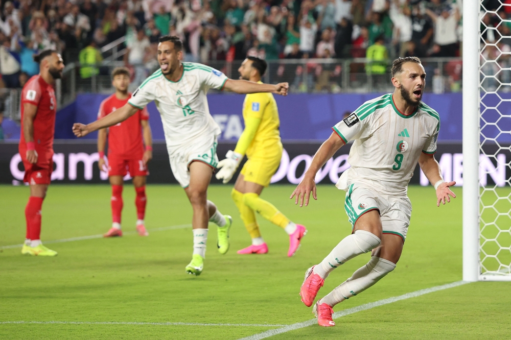 Amine Gouiri #9 of Algeria celebrates scoring his team's second goal during the FIFA World Cup 2026 Group J match between Jordan and Algeria at San Francisco Bay Area Stadium on June 22, 2026 in Santa Clara, California. Stu Forster/Getty Images/AFP 