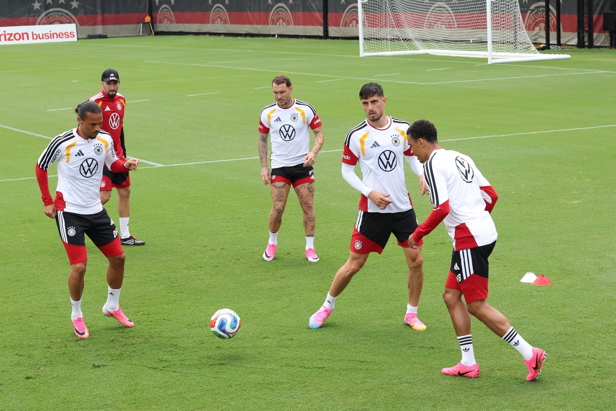 Kai Havertz of Germany trains with Leroy Sane (left) and Jamal Musiala (right).